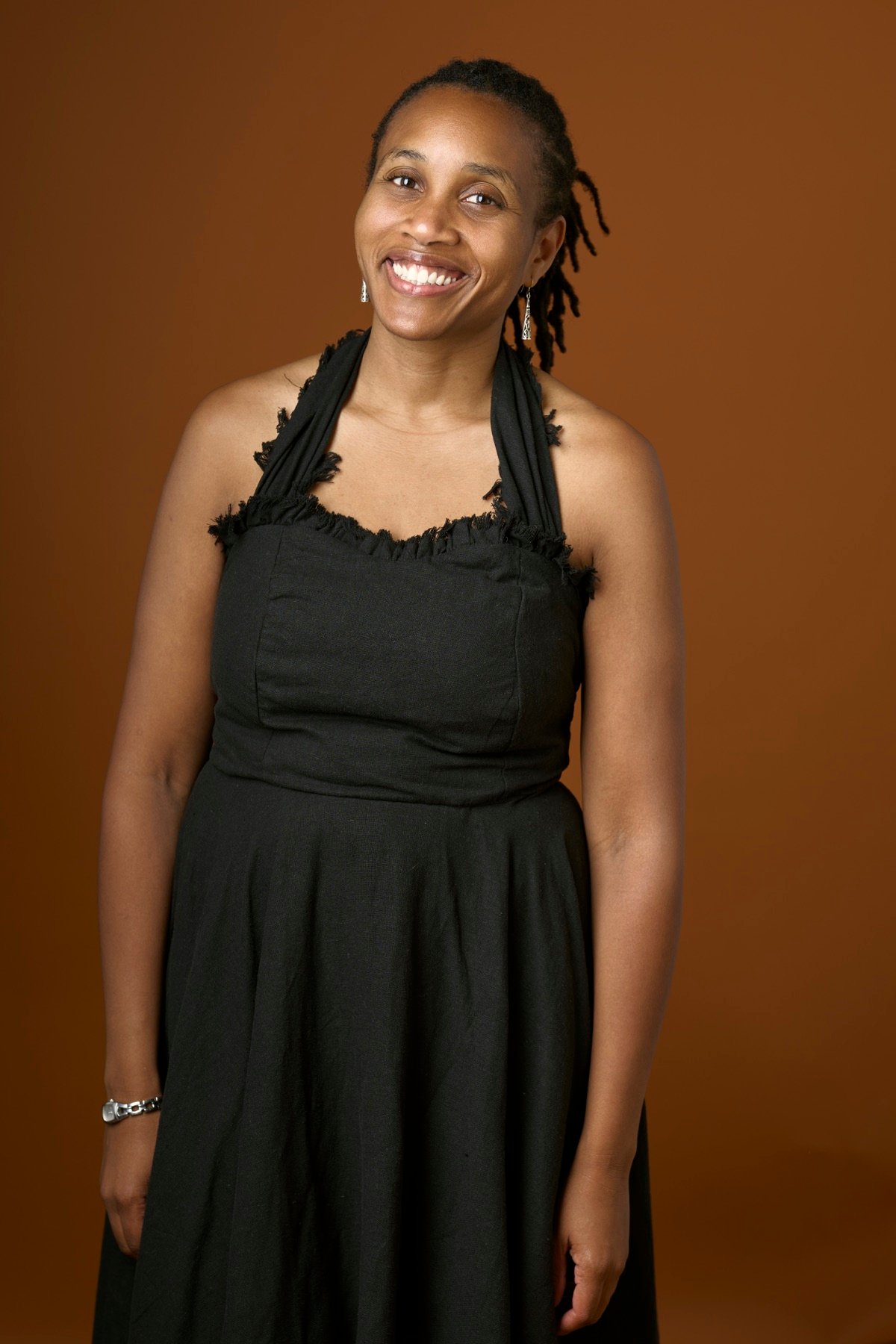 Rachel smiling in a black dress