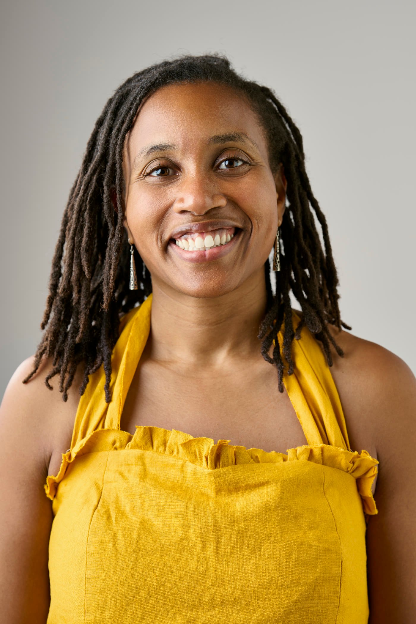 Rachel Maddox McGrath smiling in a yellow dress